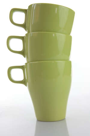 Three green mugs isolated on whiteの写真素材