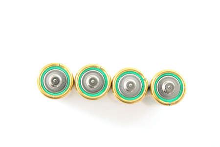 Four green batteries isolated on white background.の写真素材