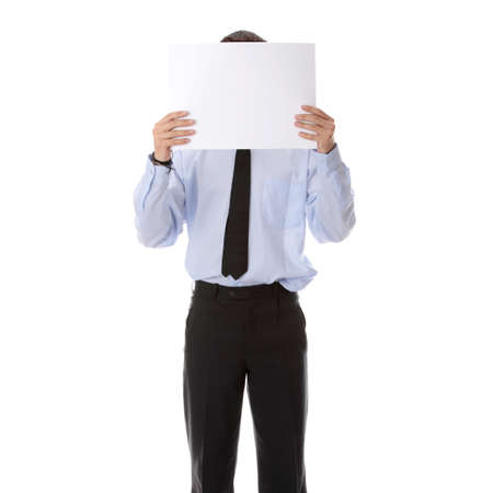 A businessman with a blank paper in his face isolated on whiteの写真素材
