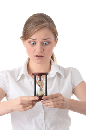 Young business woman with hourglass - time concept