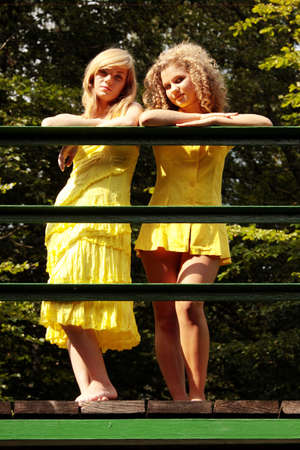 2 teen woman relaxing on sunny summer vacation dayの写真素材