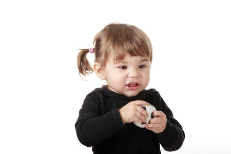 Portrait of a 2 year old girl isolated on white backgroundの写真素材
