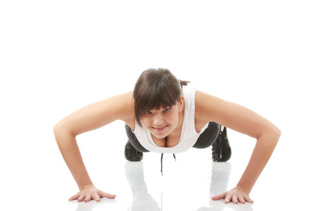 Physical training (aerobics) of beautiful young woman isolated on white background 
