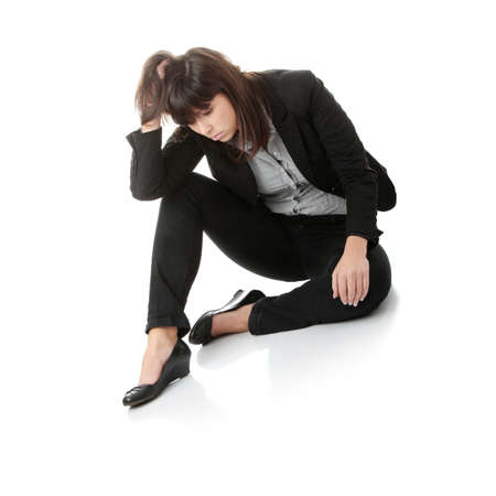 Young businesswoman depression, isolated on whiteの写真素材