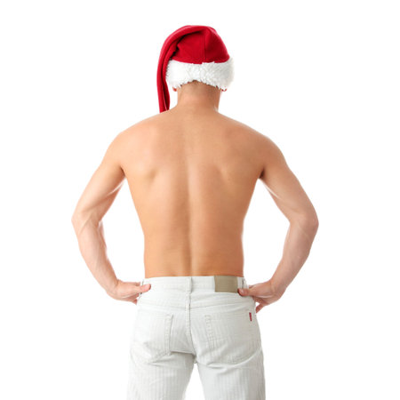 Sexy muscular man wearing a Santa Claus hat isolated on white
の写真素材