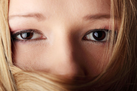 Portrait of young blond woman with hairs on her face
