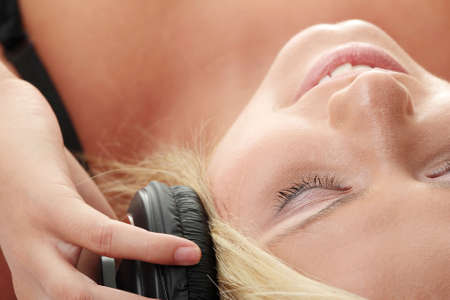 Listening to Music Isolated on whiteの写真素材