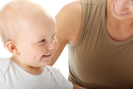 Baby boy with his mother isolated on white background