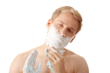 Man shaving isolated on white backgroundの写真素材