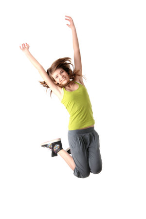 Young woman in sporstwear, jumping 