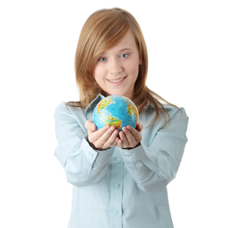 Young teen girl holding globe, isolated on white background