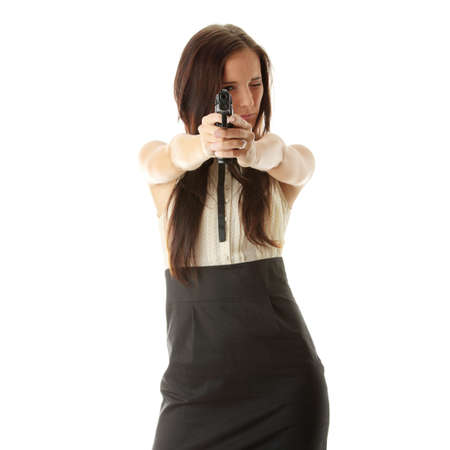 Young woman with hand gun isolatedの写真素材