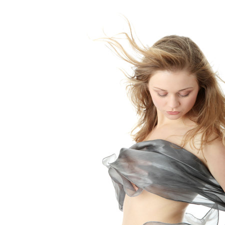 Sensual portrait of young beautiful caucasian woman dancing with wind. Isolated on white
の写真素材