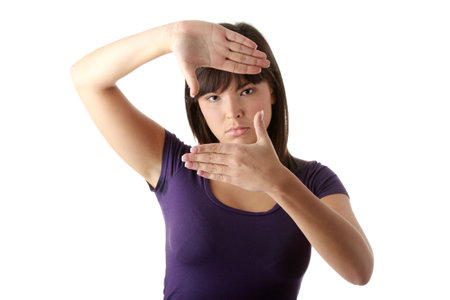 Closeup of beautiful woman making frame with her hands

の写真素材