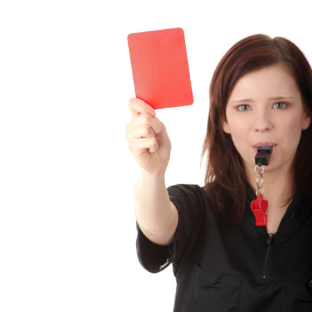 Young female referee showing the red card, isolated on white