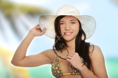 Summer woman in swimsuit and hatの写真素材