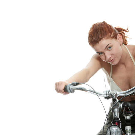 Attractive redhead woman with bike. over white background
の写真素材