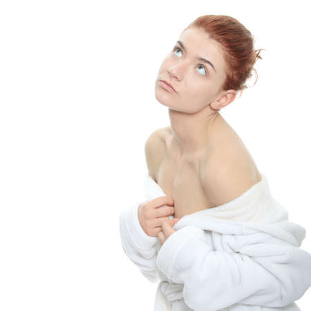 Beautiful young caucasian woman in bathrobe after bath calm portrait.
の写真素材