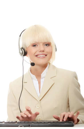 Call center woman with headset. Beautiful smiling caucasian woman isolated on white background. の写真素材