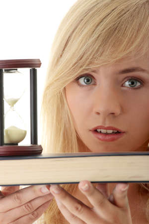 Don't have time to learn - teenager with book and hourglassの写真素材
