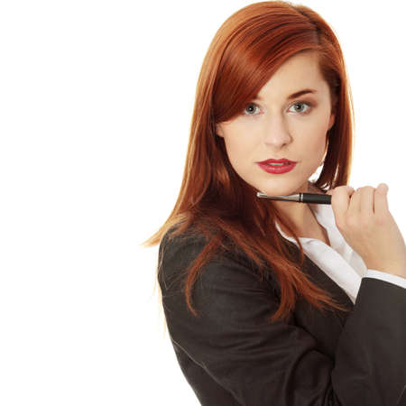 Attractive businesswoman with a pen の写真素材