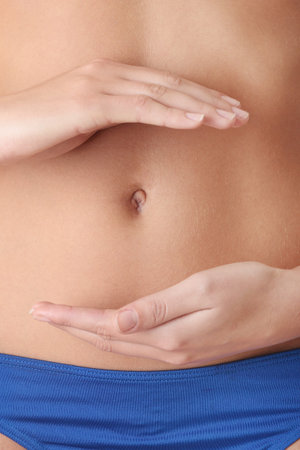 Beautiful female body isolated on white. Sexy young woman in blue panties の写真素材