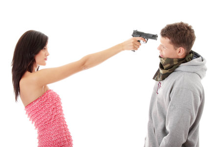 Woman with gun overpowered thug, isolated on whiteの写真素材
