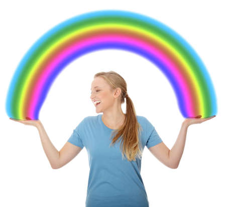 Young woman holding rainbow, isolated on whiteの写真素材