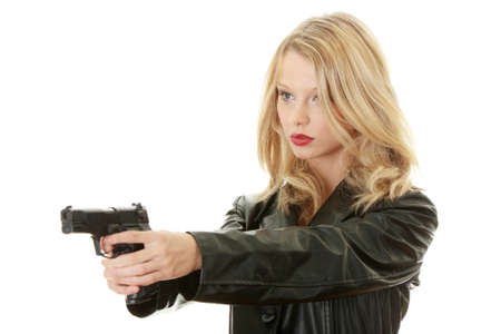 Sexy blond woman with handgun isolated on white background の写真素材