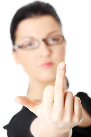 Young woman with middle finger up, isolated on white background. Focus on handの写真素材