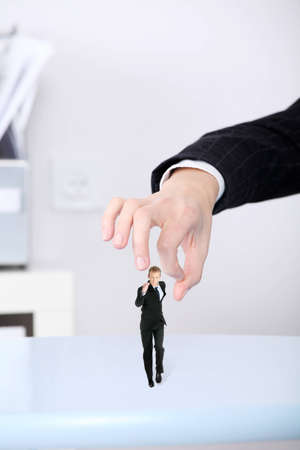 Bussineswoman getting rid of her employee.の写真素材