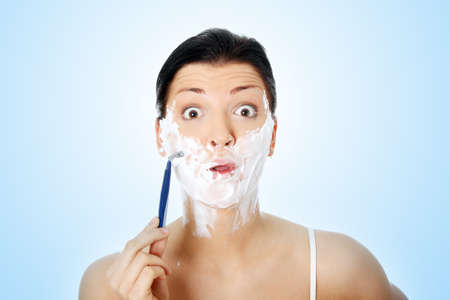 Young woman have morning shaveの写真素材