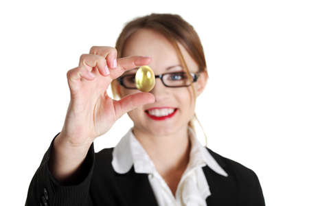 Businesswoman holding gold egg, isolated on whiteの写真素材
