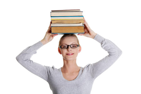 Young caucasian woman (student) with books isolated on white background
