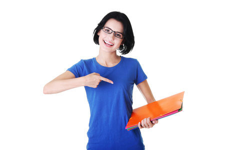 Happy student woman with notebooks, isoalted on white backgroundの写真素材