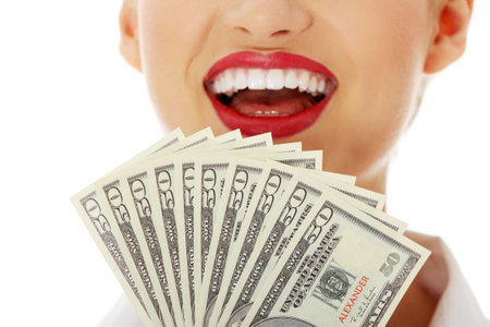 Business woman hand with dollars. Isolated on white 
