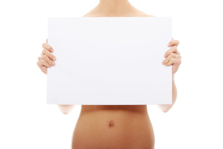 Sexy naked woman holding empty board , isolated on white. の写真素材