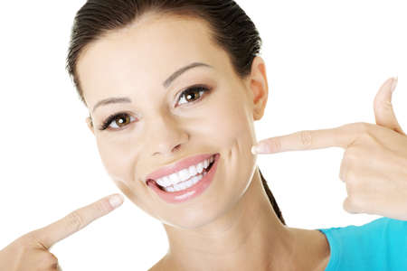 Woman showing her perfect straight white teeth. の写真素材