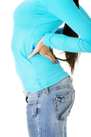 Teen student woman with back pain isolated 