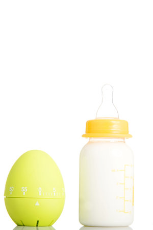 Baby milk bottle and timer close up