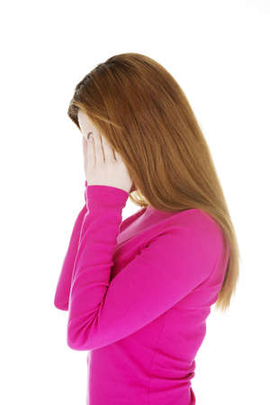 Woman with headache or problem holding her hand to the headの写真素材