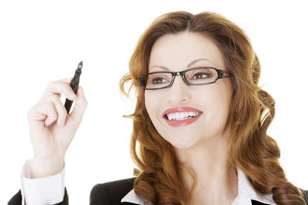 Businesswoman writing something on abstract screen, isolated on whiteの写真素材