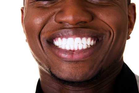 Young male smiling. Closeup. Isolated on white. の写真素材