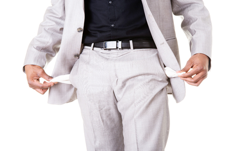 Male businessman showing open pockets. Isolated on white. の写真素材