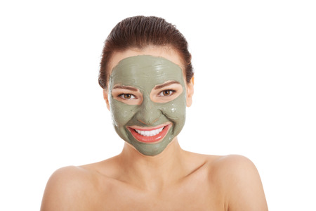 Beautifu toplessl woman with facial mask. Spa concept. Isolated on white.の写真素材