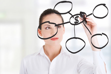 Young businesswoman writing something on abstract screen 