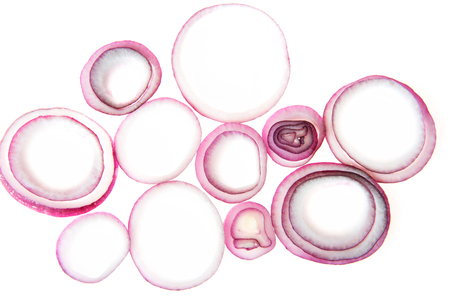 Composition of red onion rings. Isolated on white.の写真素材