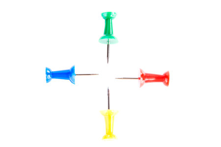 Four colorful drawing pins. Isolated on white.の写真素材