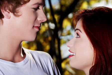 Young couple together in forest, uotdoor.