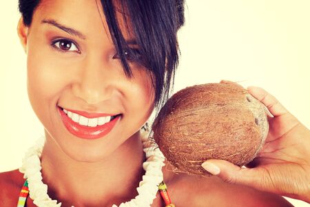 Happy excited summer woman with coconut.の写真素材